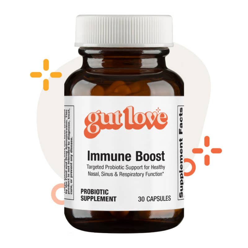Immune Boost Probiotic Supplement opaque glass bottle with fun shapes and colors behind it